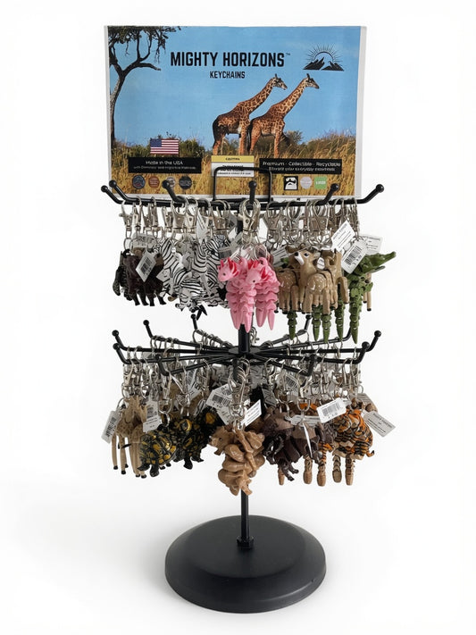Mighty Horizons two-tier black tabletop display stand fully stocked with assorted 3D-printed animal keychains and a Zoo display sign.